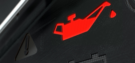 En motoroljelampe på et dashbord