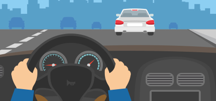 Person som kjører bil på veien